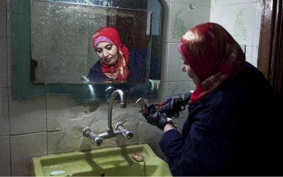 Woman plumber in red scarf