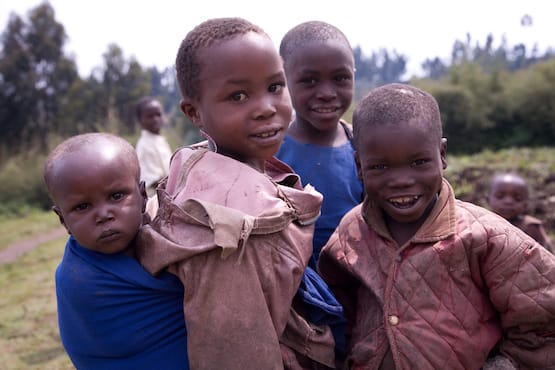 Three kids in blue and red jackets