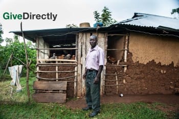 Man in front of his home