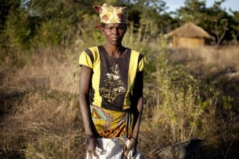 Woman in front of her home