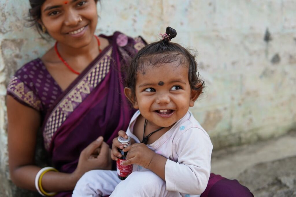 Women and child. Evidence Action Match Campaign